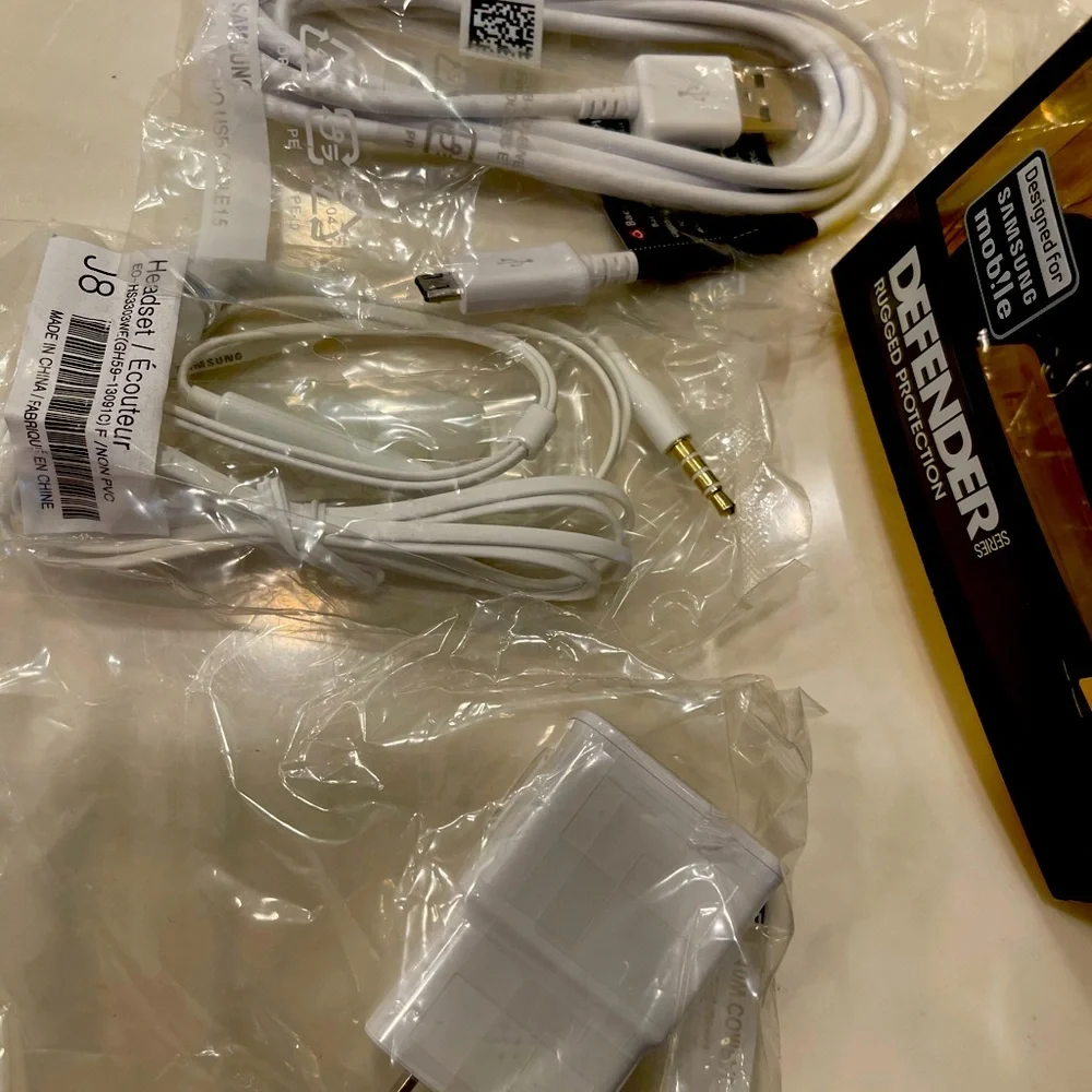 Samsung Galaxy S4 Otter Box, charger, earbuds.NEW